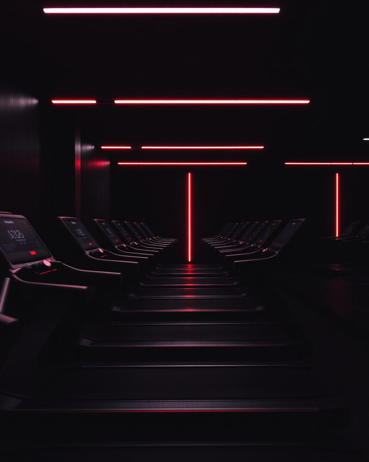 Cardio zone with treadmills and red LED lighting